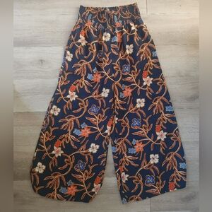 Sienna Sky Navy Floral Print Pants with Orange and Yellow Floral Accents
